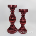 red colored large glass candlestick holder